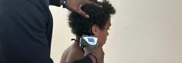 Dr. Cooley using an Insight Scanner on a patient's neck